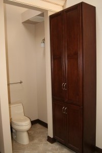 We enclosed the toilet and added a linen cabinet     