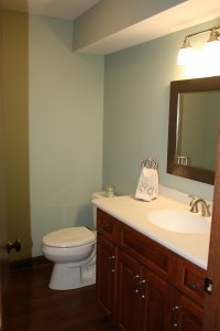 After powder room, we could not remove the soffit. We added bamboo floors, kitchen height vanity, and comfort height toilet.     